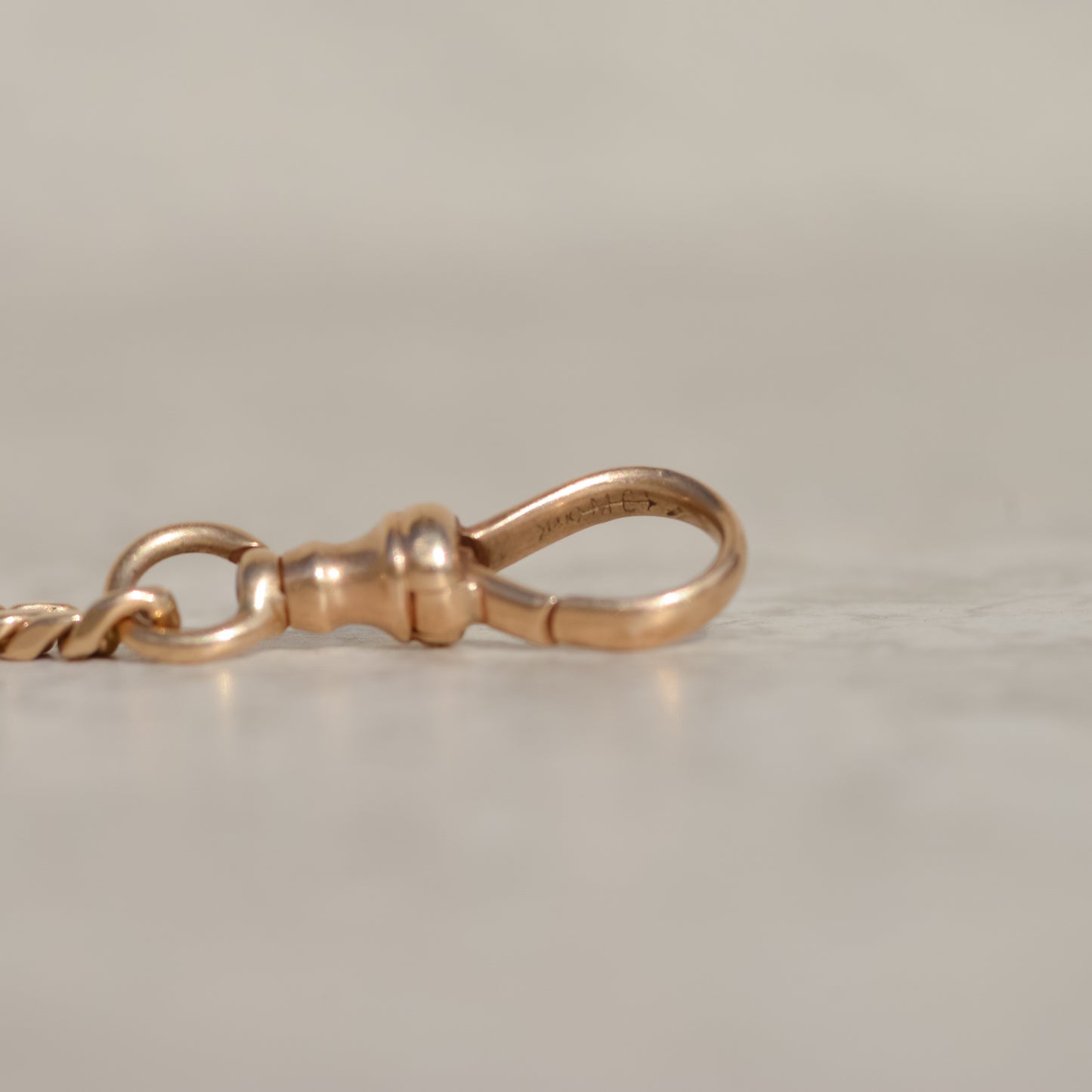 Maker's mark on chain, for Martin-Copeland Co, a Providence, RI based jeweler active 1910-30s