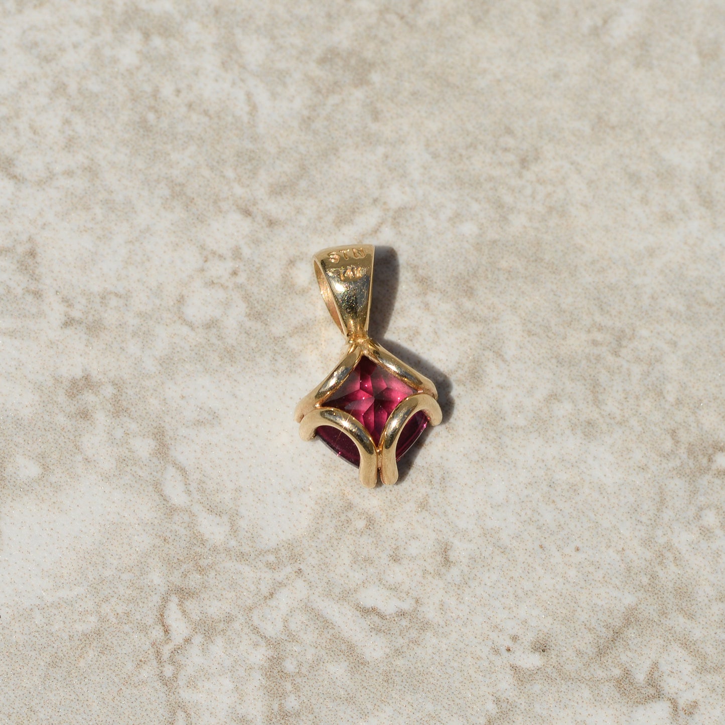 Vintage Buff-top Garnet Charm