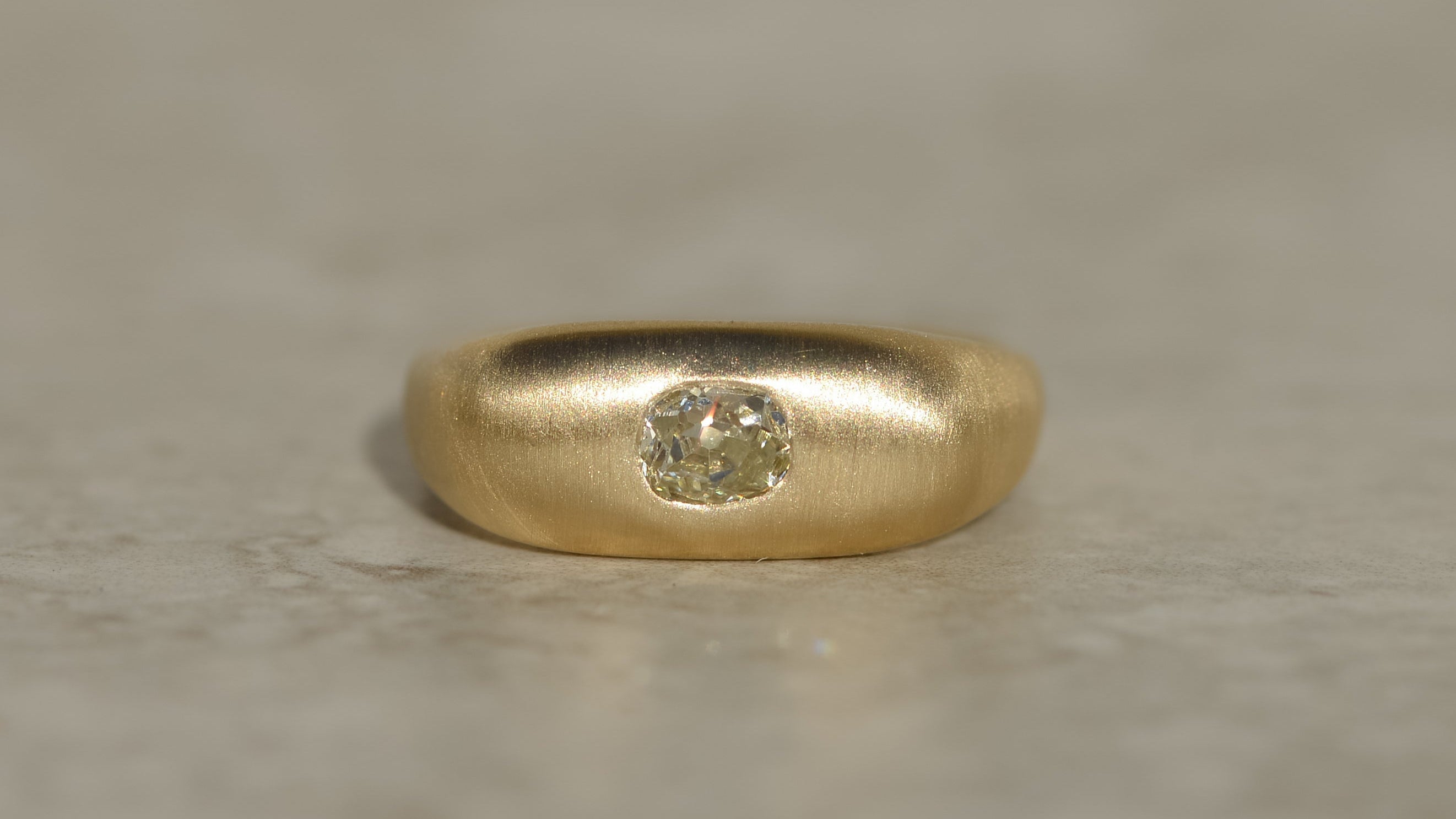 studio molimo chunky ring with an old mine cut diamond in brushed yellow gold