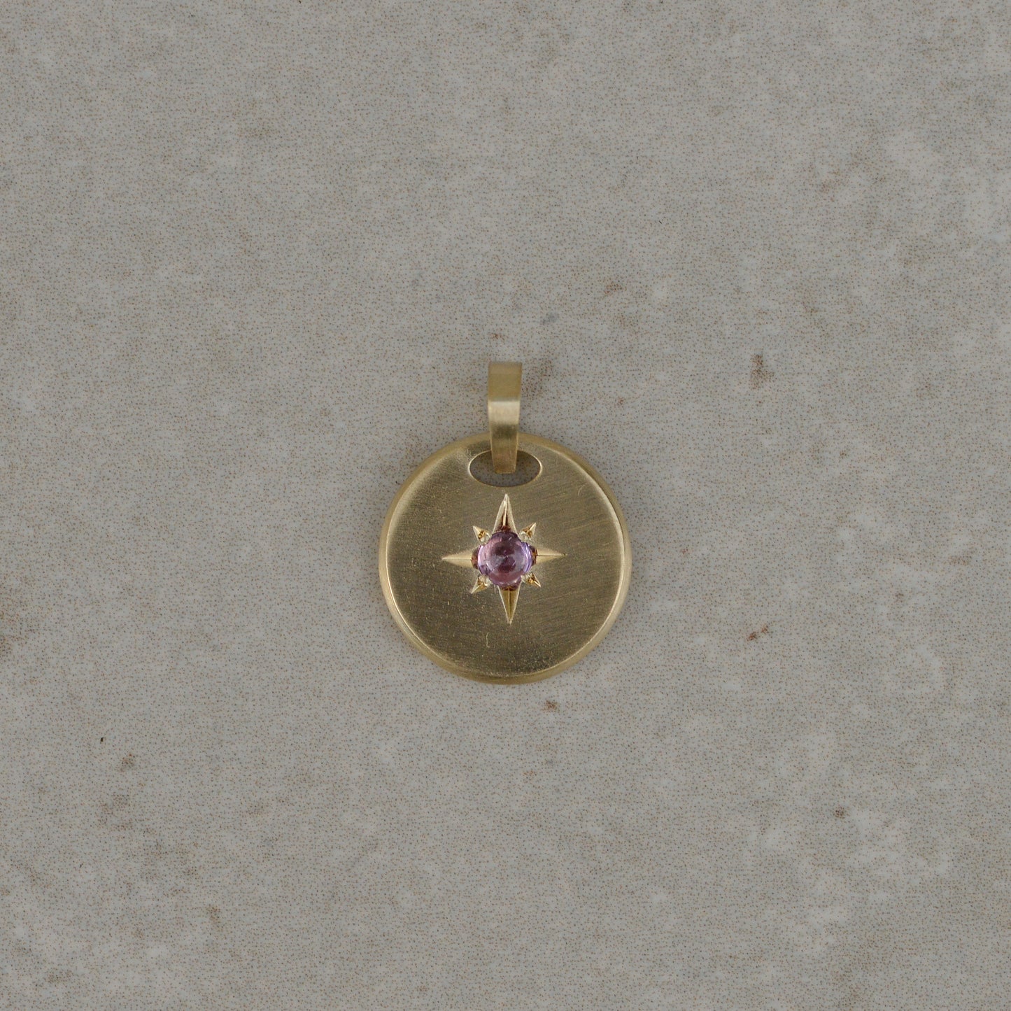 11: Star-set charms, sapphire cabochon