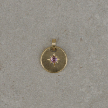Round star-set charm, sapphire cabochon