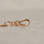 Maker's mark on chain, for Martin-Copeland Co, a Providence, RI based jeweler active 1910-30s