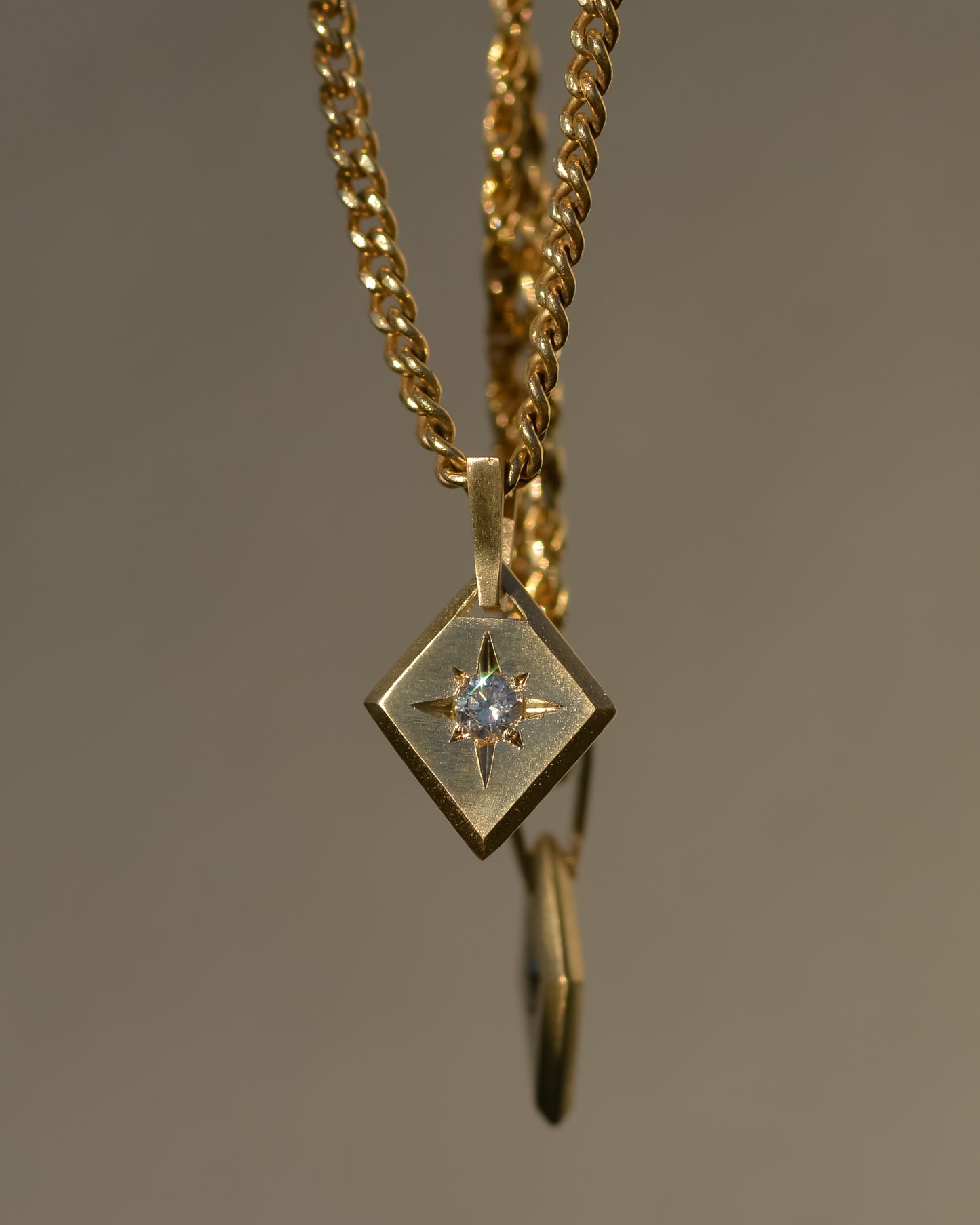 11: Lozenge Star-set charm, diamond