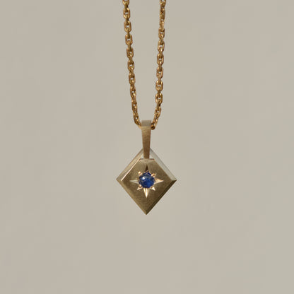 Lozenge Star-set charm, sapphire cabochon