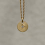 Round-shaped tag pendant with star set white round brilliant cut diamond