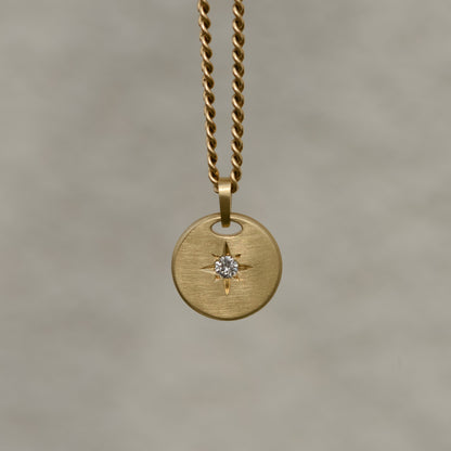 Round-shaped tag pendant with star set white round brilliant cut diamond
