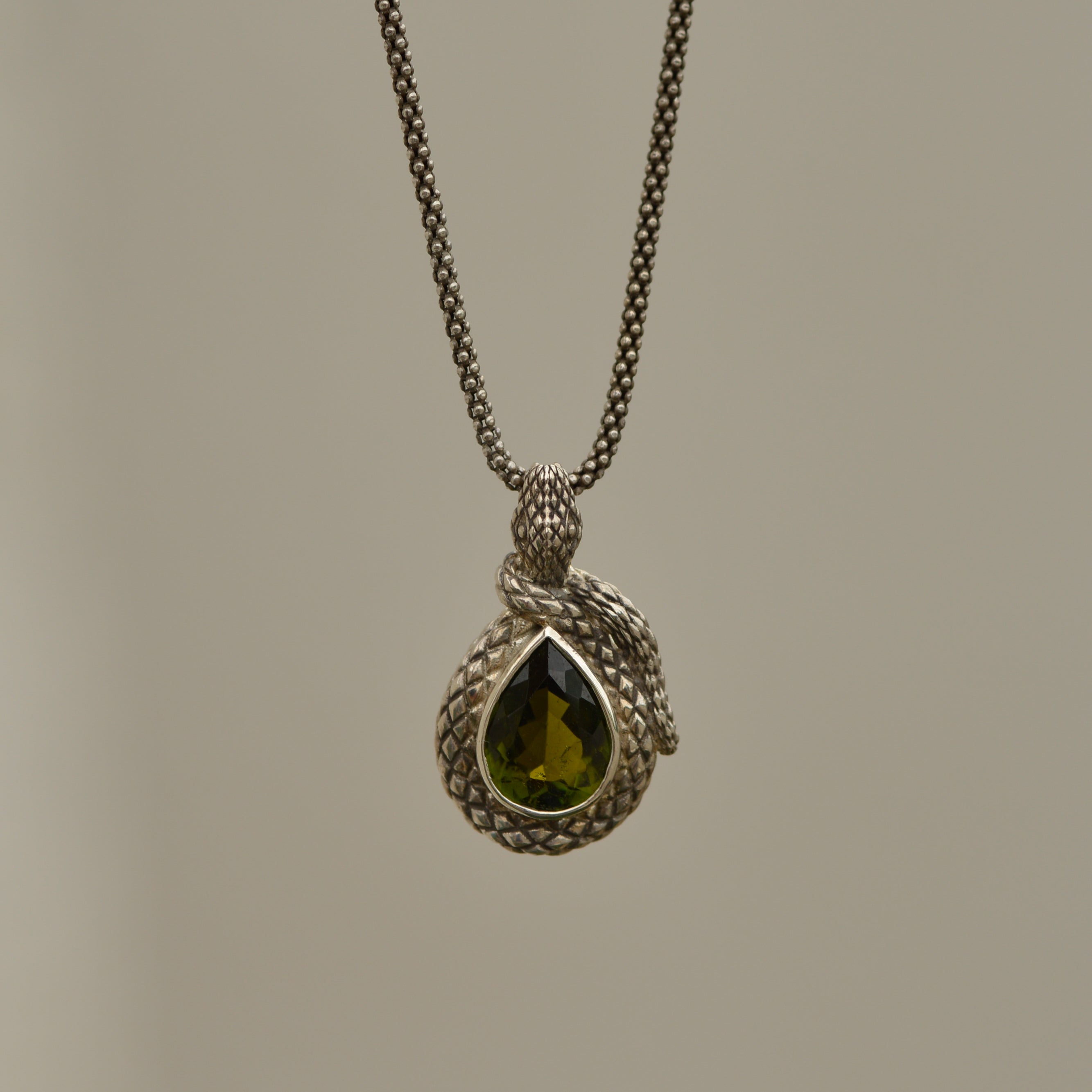 Year of the Snake pendant, green tourmaline