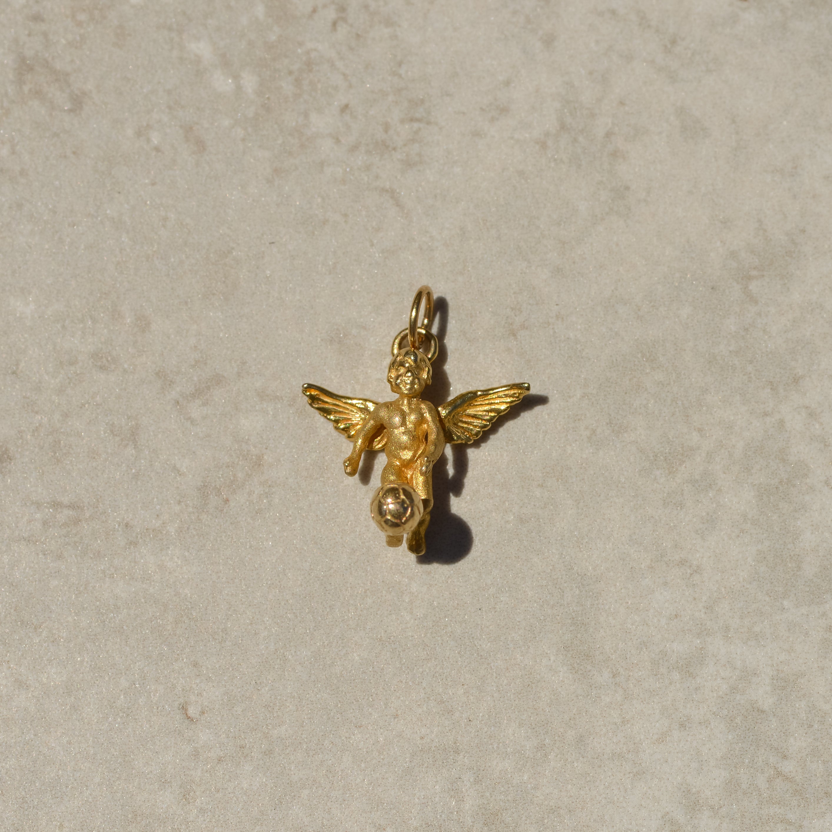 Vintage Soccer-playing Cherub Charm