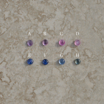 Round star-set charm, sapphire cabochon